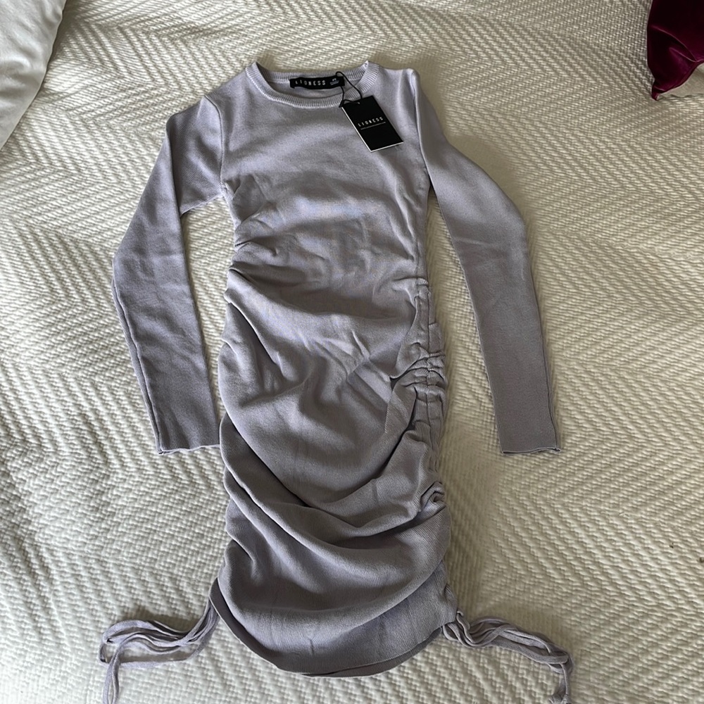 Long sleeve mini dress with tags never been worn